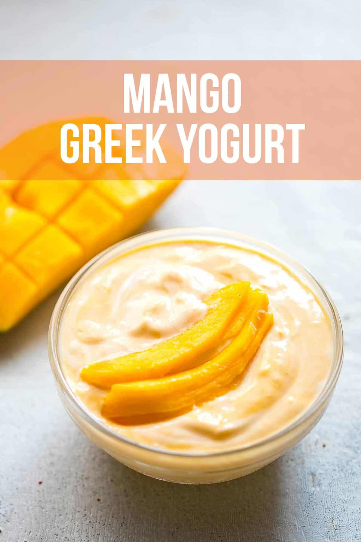 Mango greek yogurt served in a bowl with sliced mango on top