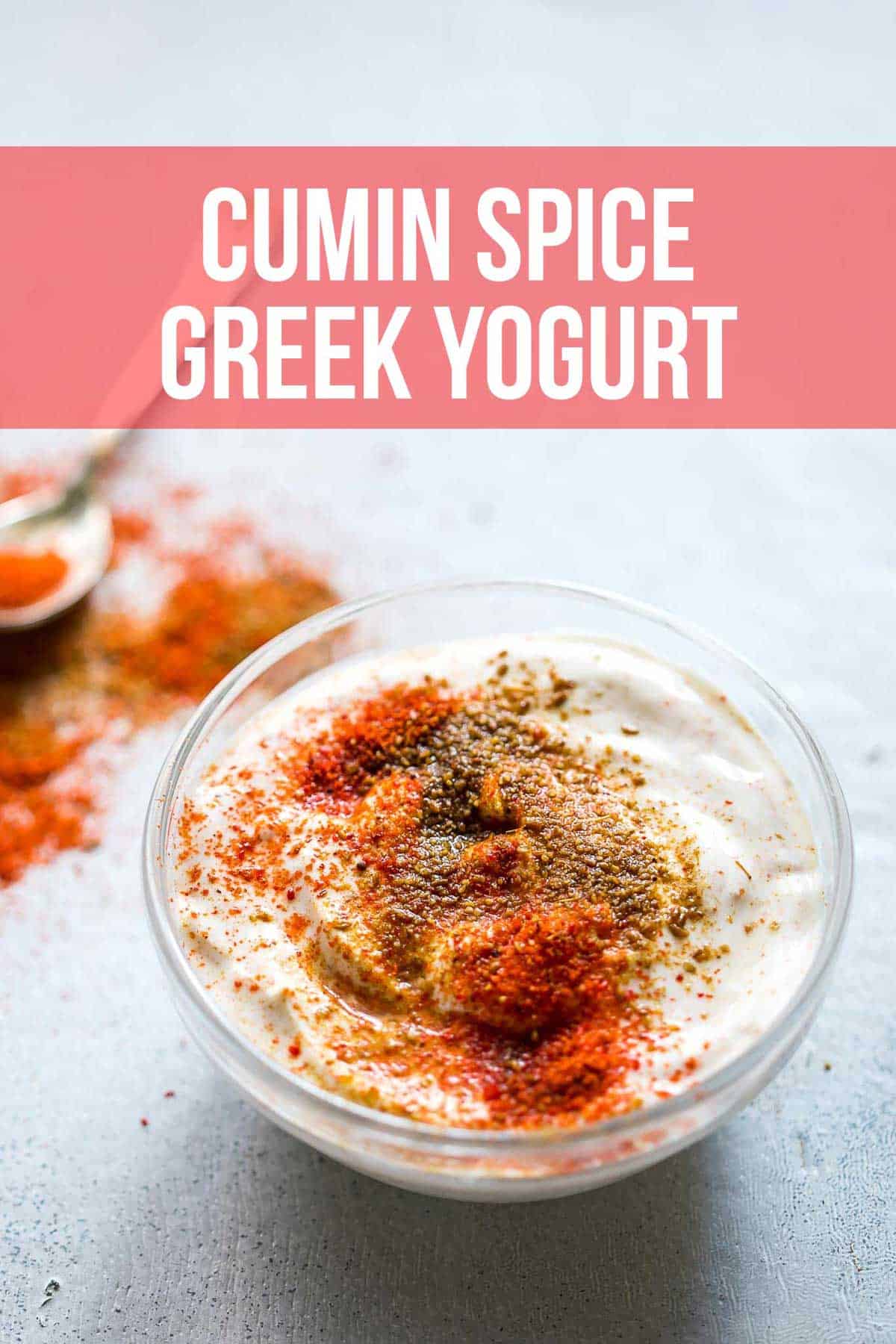 Cumin spice greek yogurt served in a bowl with cumin and chilli powder sprinkled on top