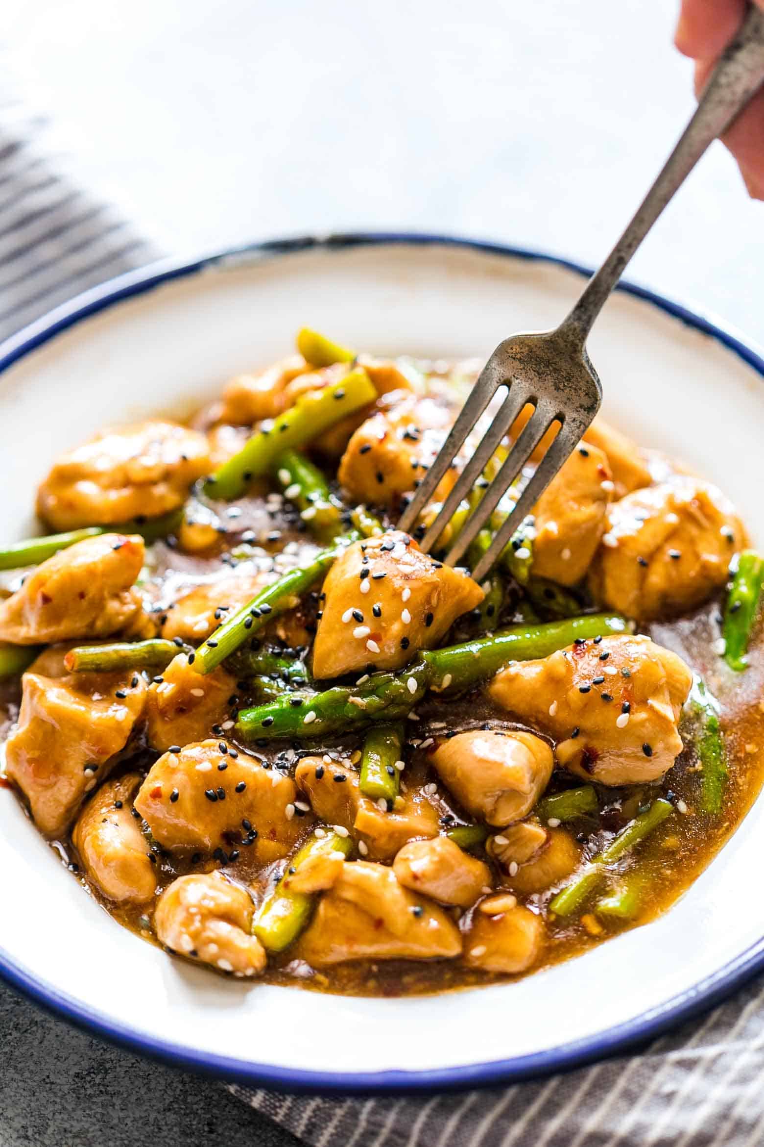 Easy lemon ginger chicken asparagus stir fry is a quick, 30 minute asian recipe that's sure to be a hit with the family. It's low carb and can gluten free too so you can enjoy it guilt-free!