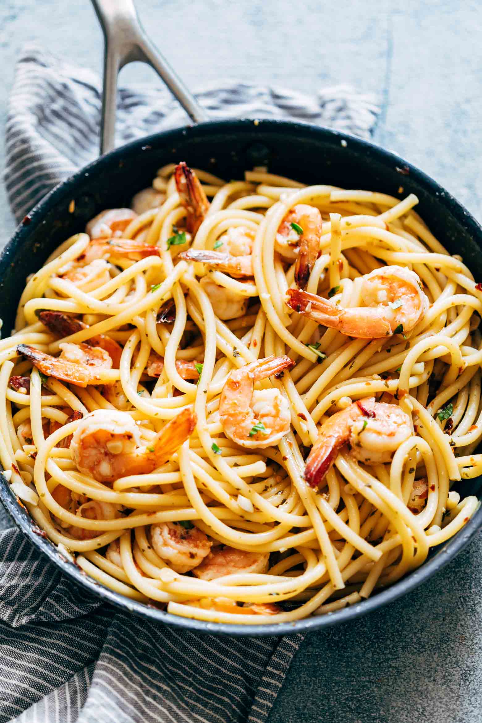 Shrimp Spaghetti Aglio Olio is a 5 ingredient pasta recipe (shrimp, olive oil, garlic, peperoncino or chilli flakes and parsley) thats ready in 20 minutes and has the easiest, most delicious pasta sauce you'll ever make!