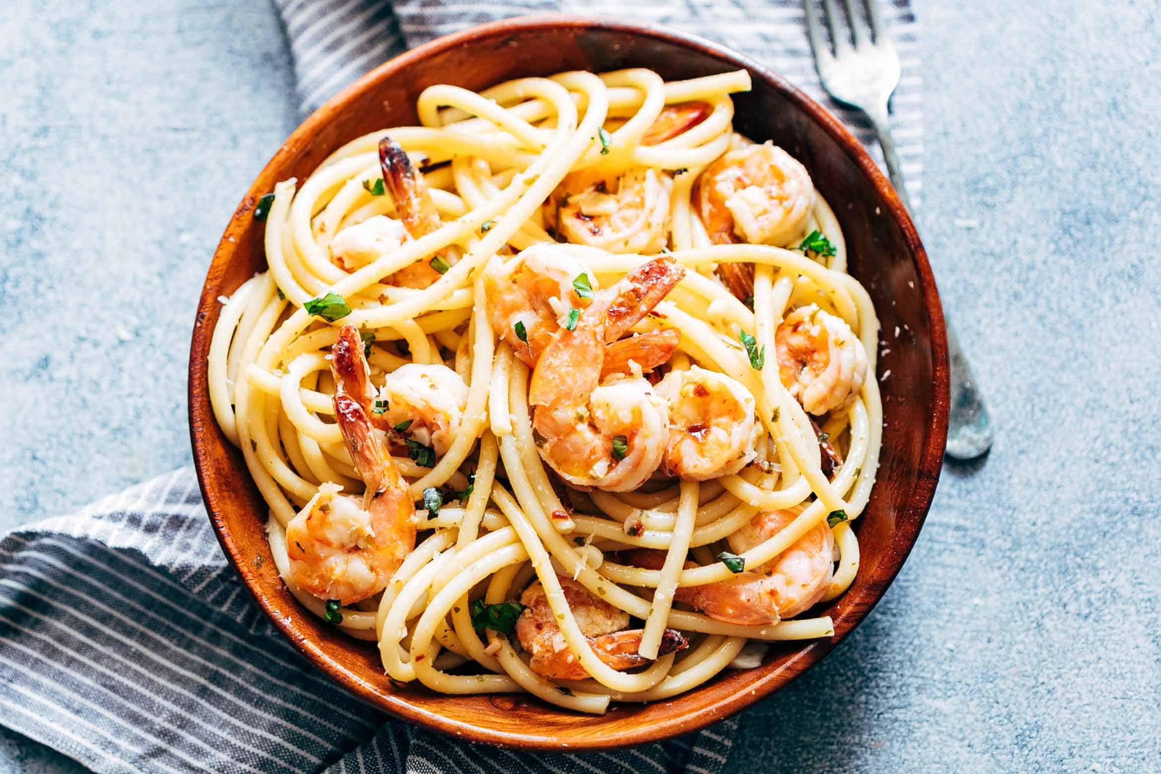 Shrimp Spaghetti Aglio Olio is a 5 ingredient pasta recipe (shrimp, olive oil, garlic, peperoncino or chilli flakes and parsley) thats ready in 20 minutes and has the easiest, most delicious pasta sauce you'll ever make!