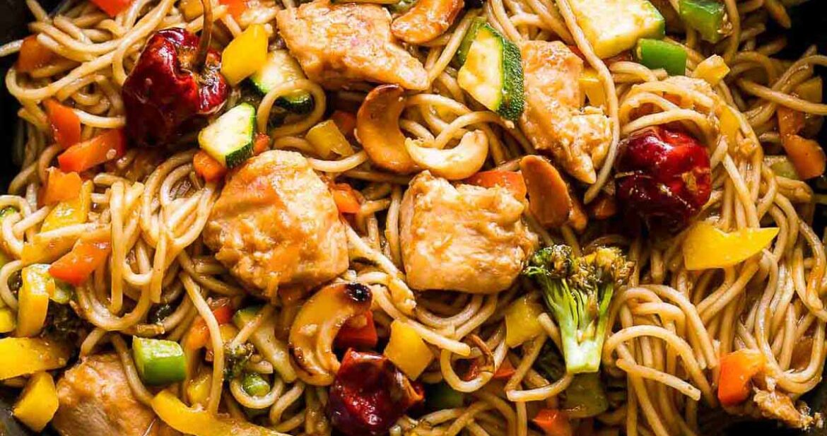 Chinese Cashew Chicken Noodles Stir-Fry in a pan.