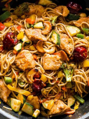 Chinese Cashew Chicken Noodles Stir-Fry in a pan.