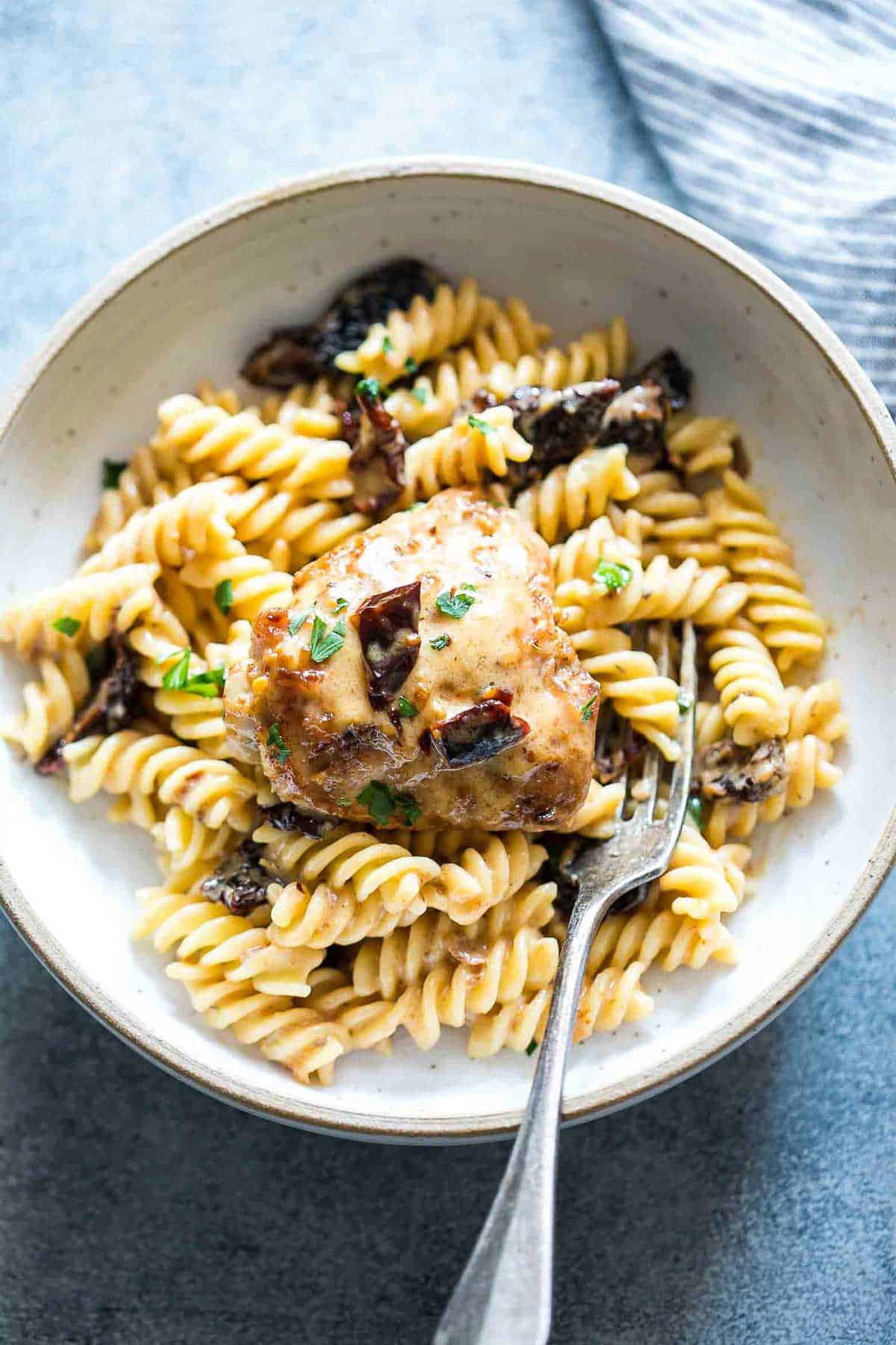 Creamy Sun-dried Tomato Chicken served with Pasta in a bowl.