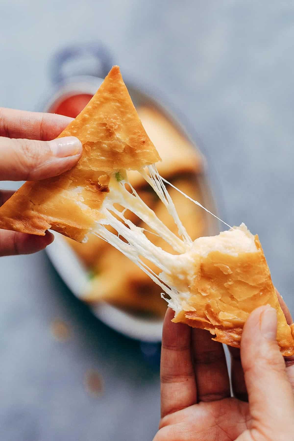 Super cheesy jalapeno three cheese samosa are sure to become a favourite because who can resist gooey stringy cheese stuffed in crispy samosa wrappers! These vegetarian samosas have a filling of mozzarella, cream cheese, smoked cheddar and jalapenos and folding them is really easy too. 