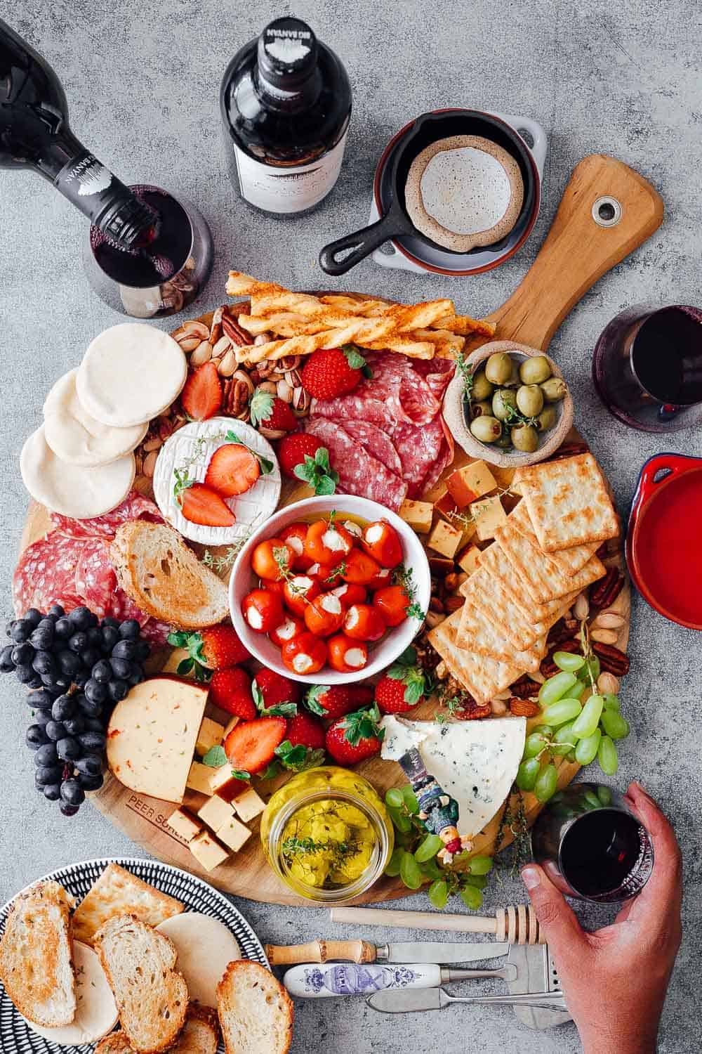 Learn how to make the Ultimate Wine and Cheese Board on a budget with simple tips and tricks. You'll be a DIY cheeseboard ninja by the end of this detailed post. Perfect for Christmas holidays, as a party appetizer for a crowd or for a romantic dinner date.