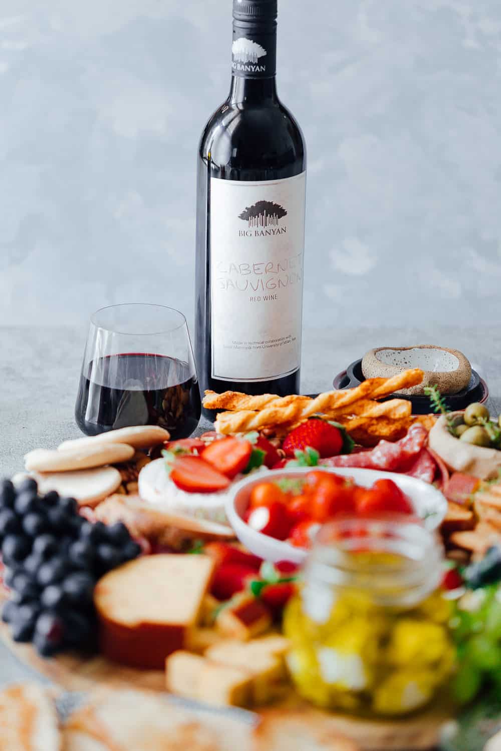 The ultimate wine and cheese board on a budget is not complete with the perfect wines. Pictured here is a cabernet sauvignon with the cheese platter