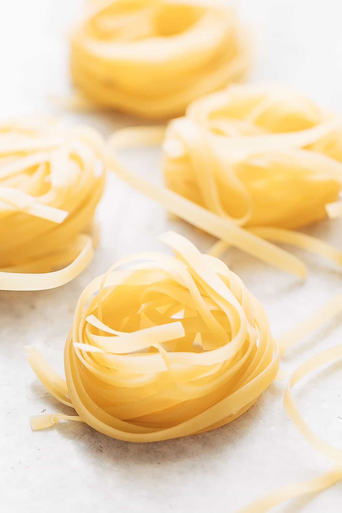 A picture of dried tagliatelle pasta for creamy prawn scampi pasta recipe