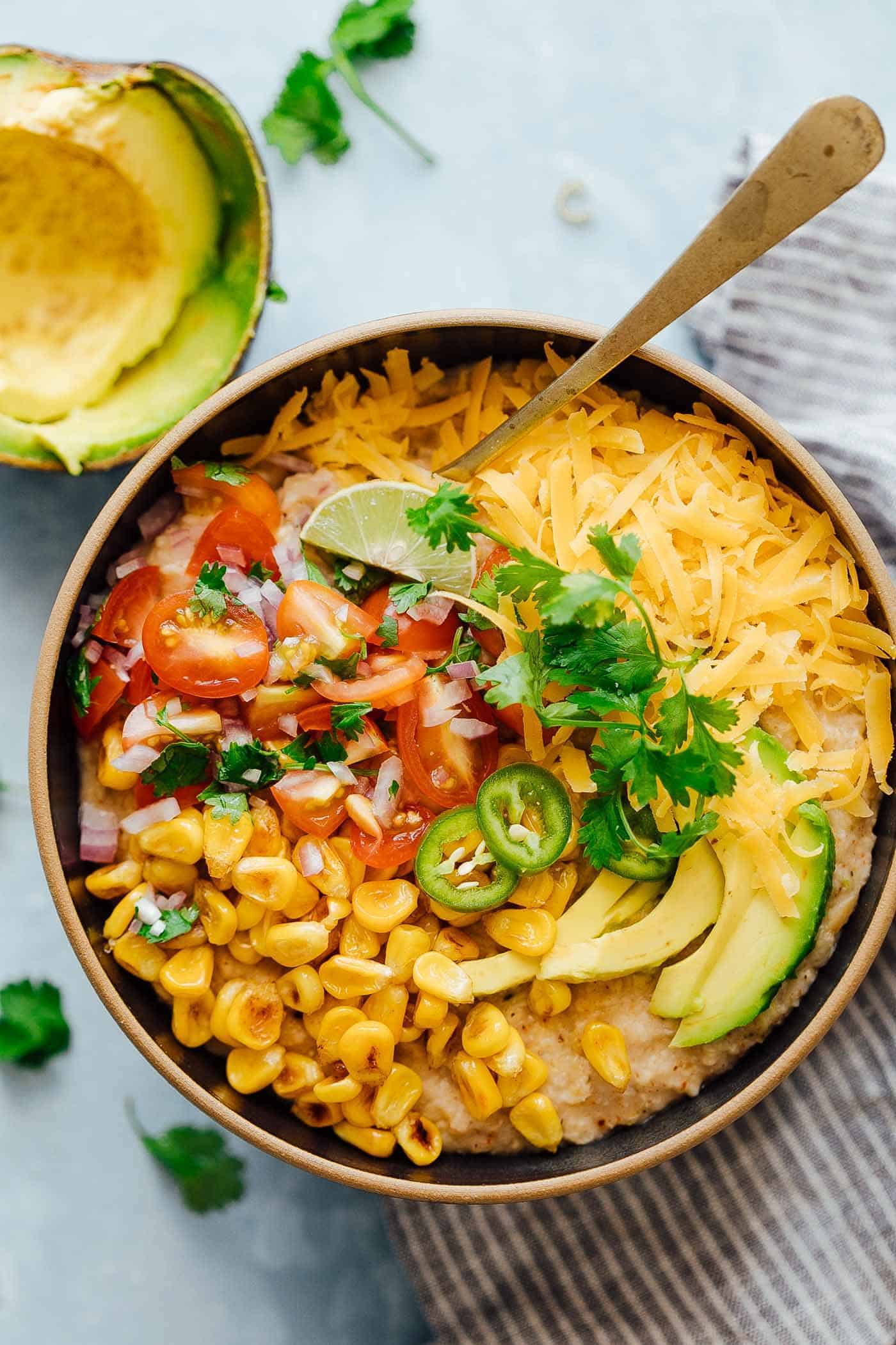 This Mexican oatmeal bowl is the healthier version of a Mexican breakfast bowl. The oatmeal is seasoned with all the spices that go into your favorite taco, and then topped with salsa, corn, avocado, jalapenos and cheddar. Super simple to make but you’ll feel like a king when you dig into this!
