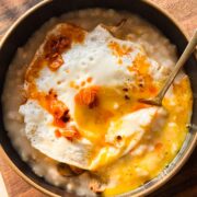 savoury garlic oats served in a bowl with a spoon