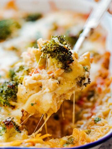 Cheesy spoonful of healthy cauliflower rice broccoli casserole.