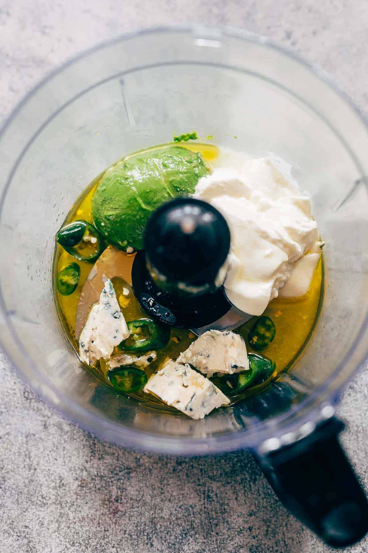 creamy avocado blue cheese dressing ingredients in a blender