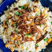 This pressure cooker veg pulao recipe is fragrant, fluffy and perfect every single time! Making this in an instant pot or any other pressure cooker ensures that everything cooks fast. Cooked with whole spices and lots of vegetables, this is the perfect side dish.