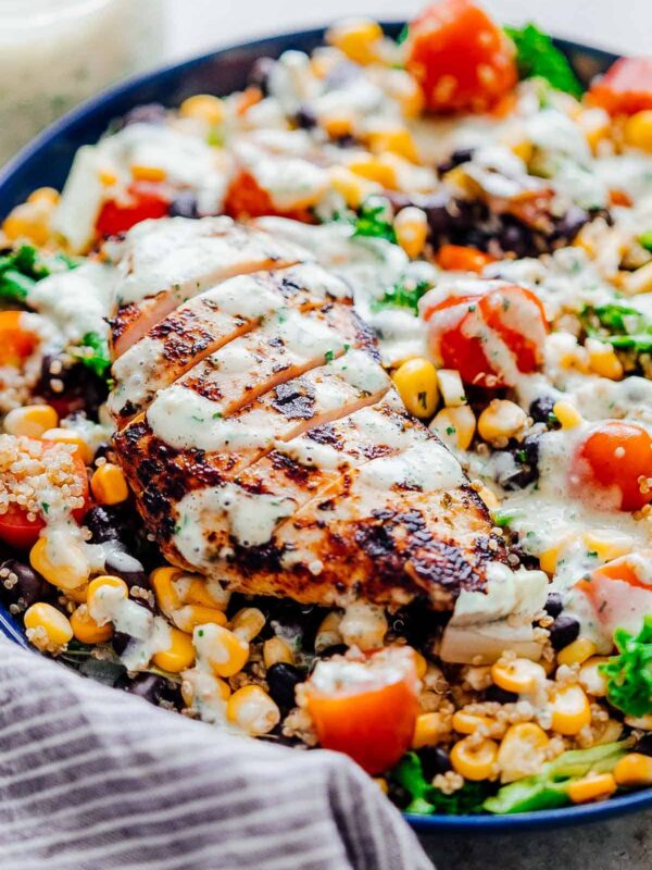Closeup of dressing drizzled on southwest chicken quinoa bean salad