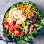 Like promised, here's a fabulous chicken cobb salad that has all the right fixings including grilled chicken and lots of bacon! Serve this with a creamy avocado blue cheese dressing that's made with greek yogurt and you have dinner sorted. This isn't just a salad, it's a meal!