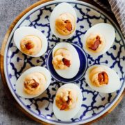 If you think regular deviled eggs are great, these spicy salary deviled eggs are the bomb! They have a kick from the heat, and smokiness from the salary and are really fast to put together. #eggs #brunch #easter #spring #recipes #appetizer #snack