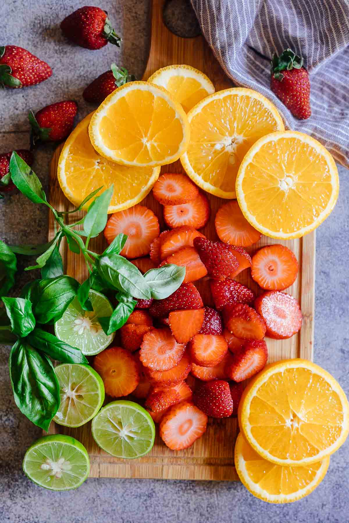 Cut fruits for strawberry orange white wine sangria
