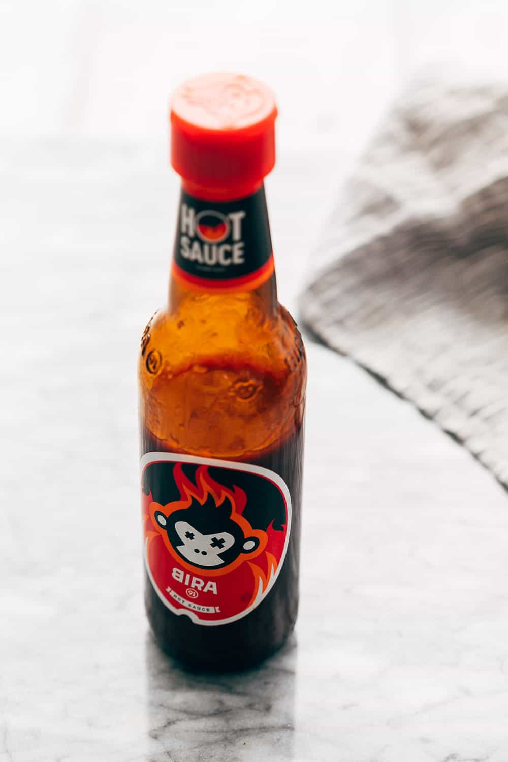 Picture of Bira's hot sauce on the countertop