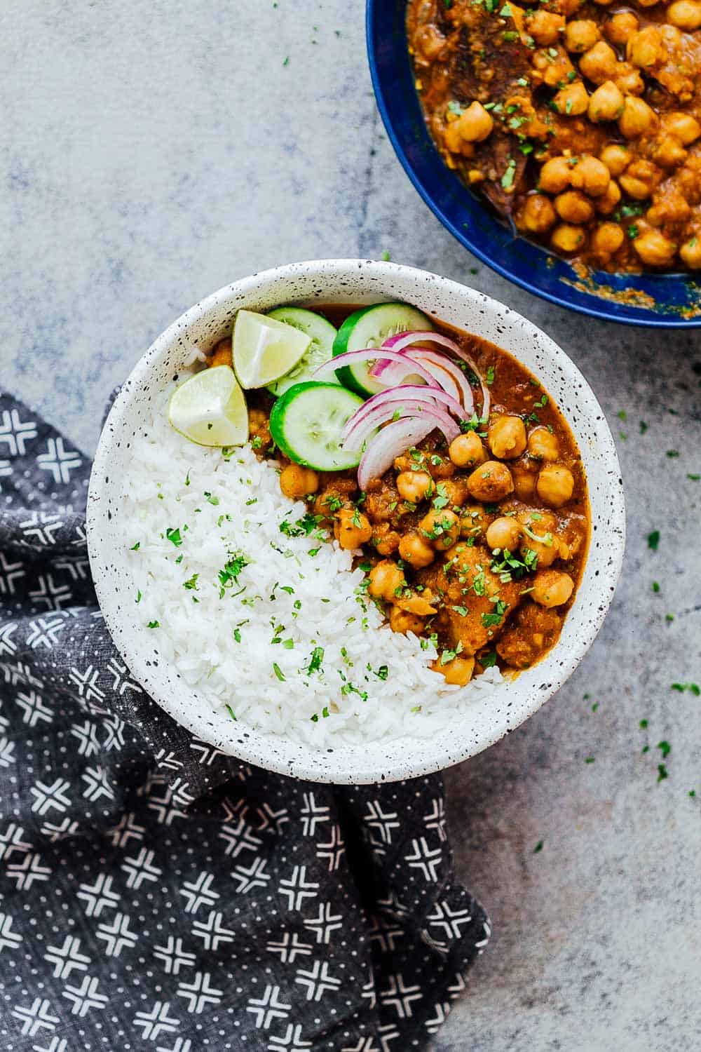 Pressure cooker chana masala served in a bowl with rice on the side