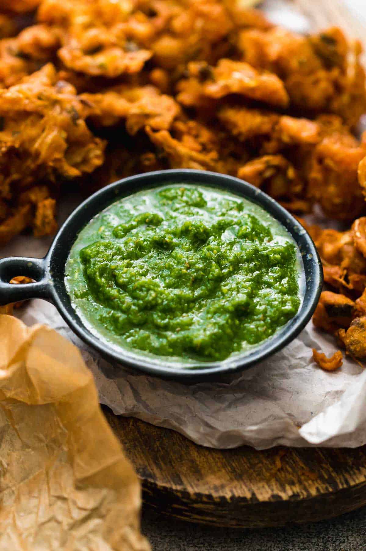 Green Cilantro Chutney served with pakoras or fritters on the side.