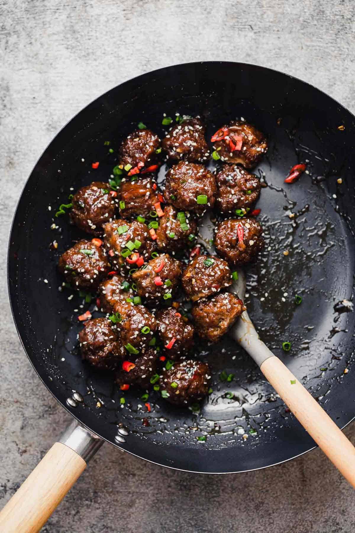 Sticky Thai Meatballs tossed in a wok