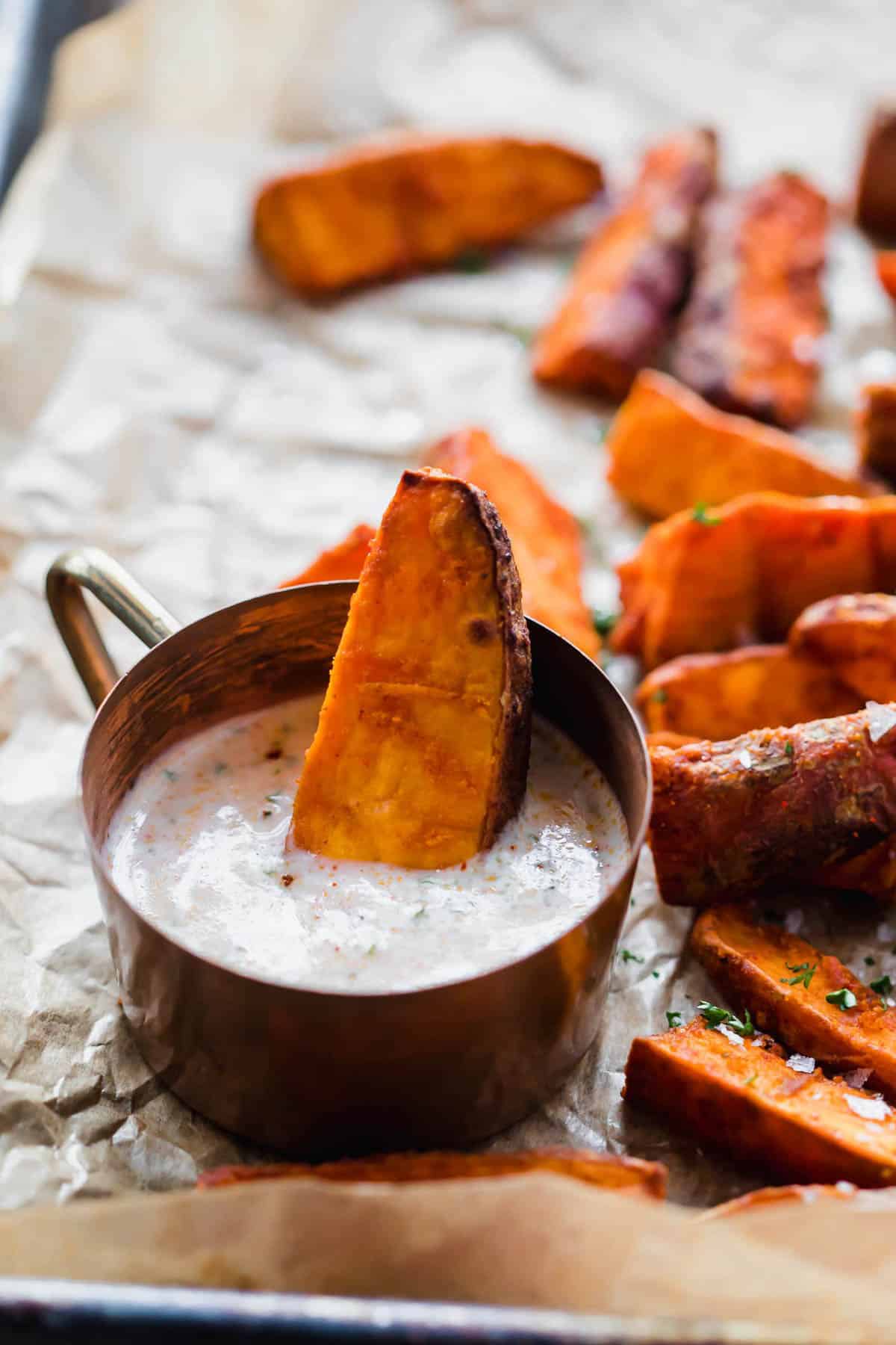 Chilli Lime Sweet Potato Wedges dunked in a dipping sauce