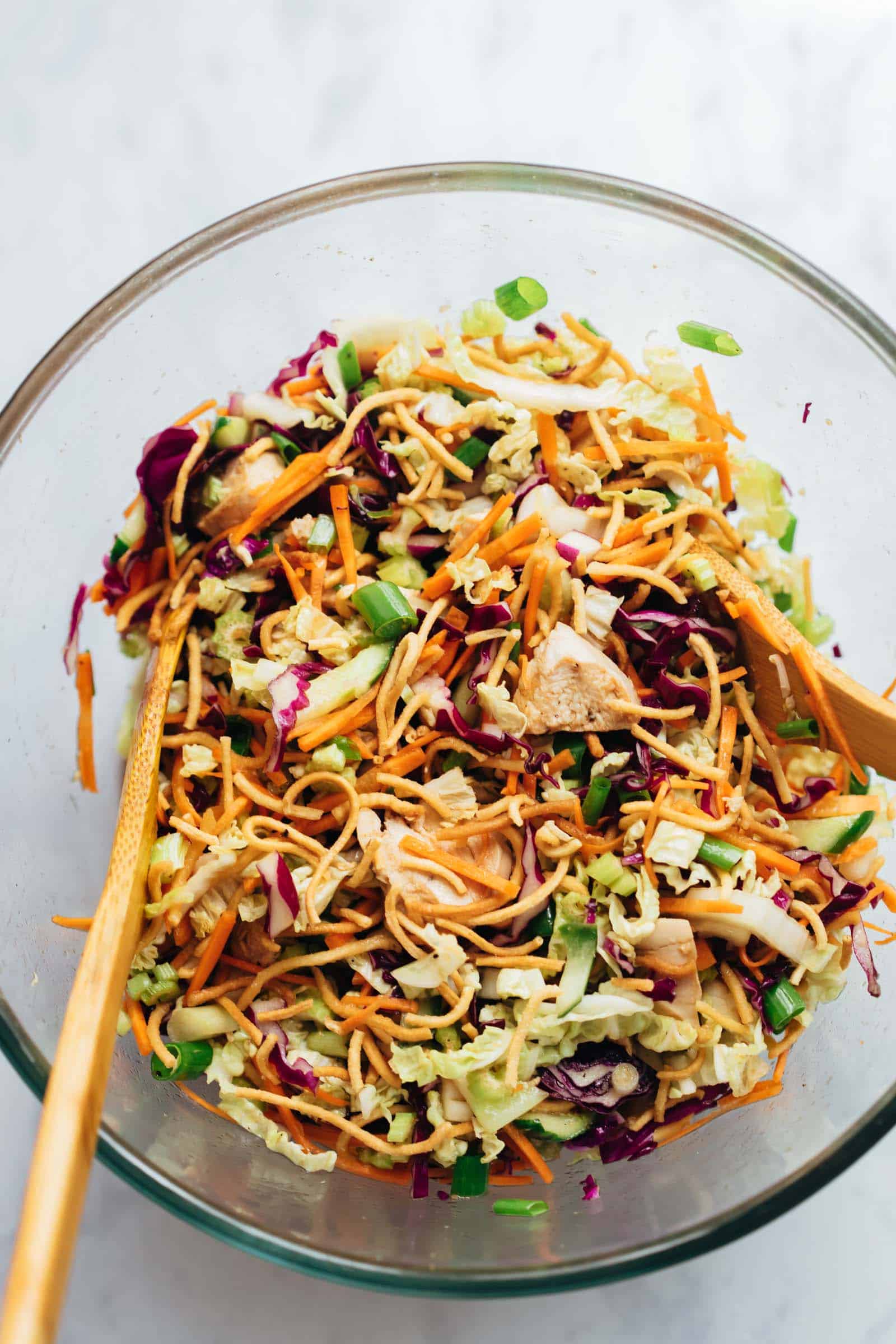 Crunchy chinese chicken salad tossed in a large bowl