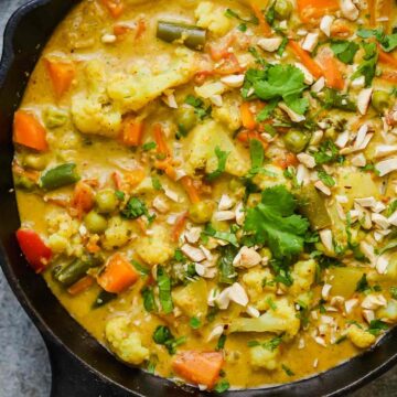 Vegetable Korma Curry straight from the stove served in a cast iron pan