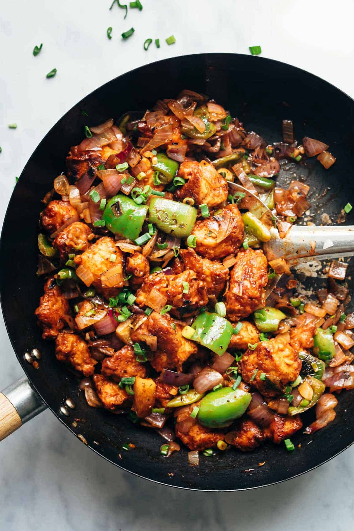 Easy Chinese Chilli Chicken Dry in a black wok.
