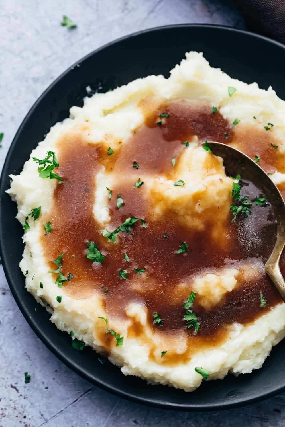 Brown vegetarian gravy poured over mashed potatoes