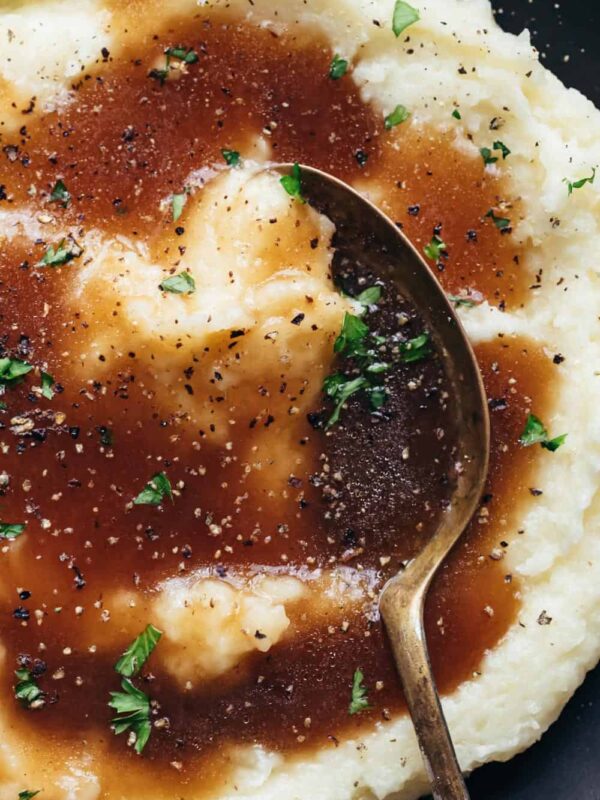 Closeup of brown vegetarian gravy served over mashed potatoes