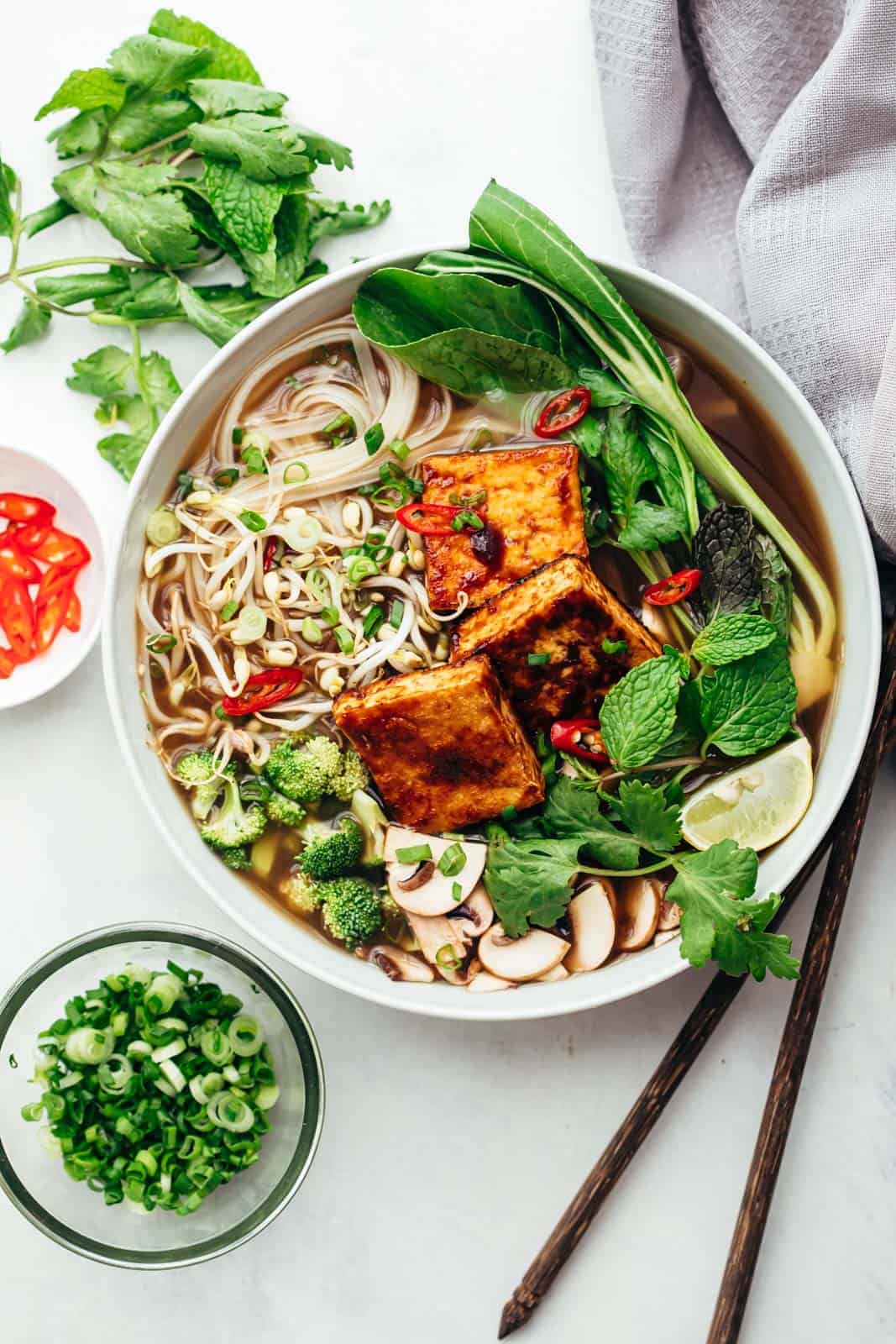 Vegetarian pho soup served in a bowl with lots of toppings