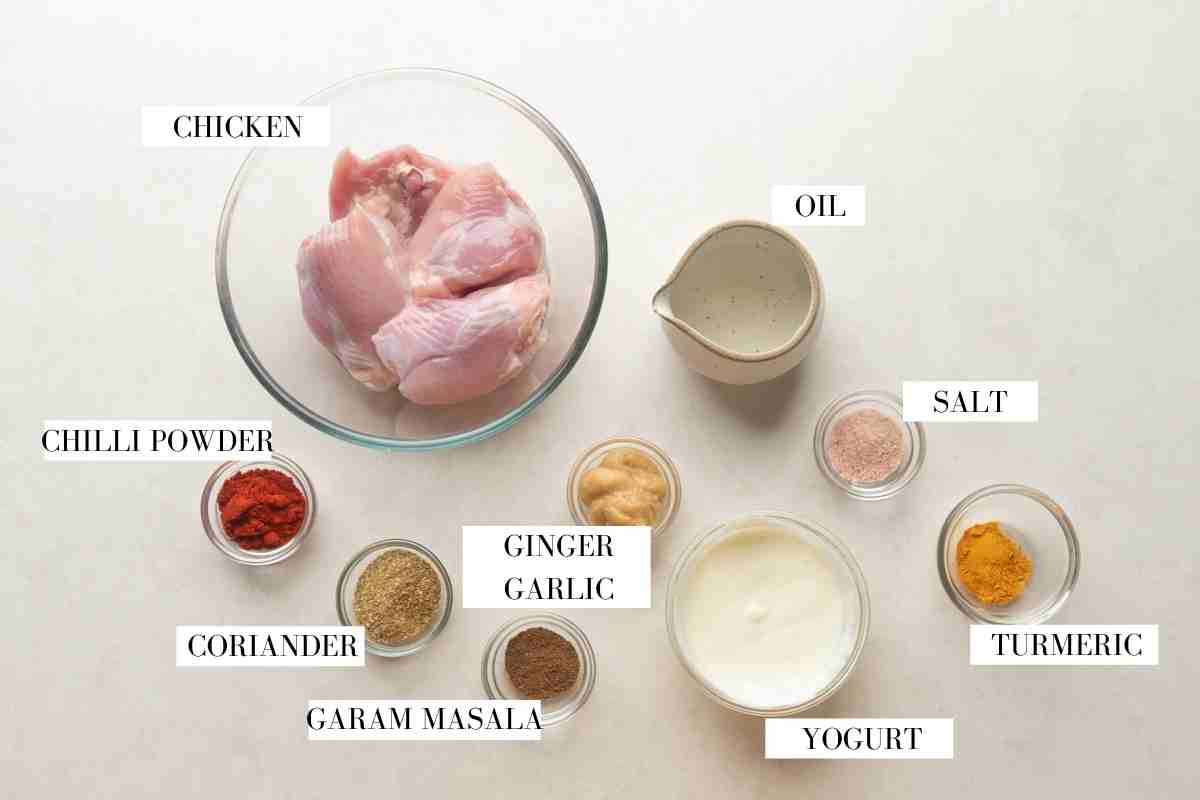 Picture of all the ingredients for butter chicken marinade with text to identify each ingredient