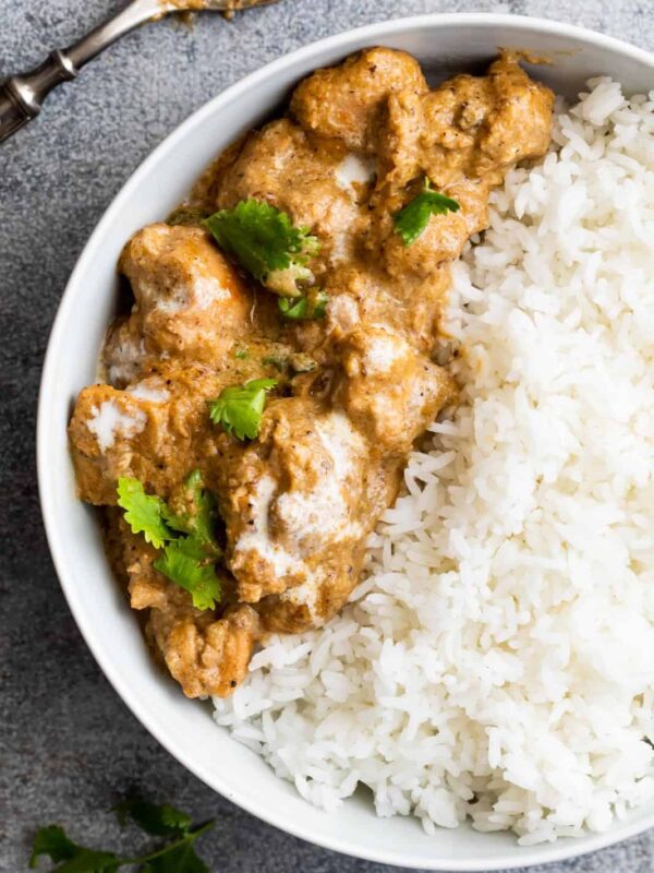 Easy chicken korma served in a bowl with rice