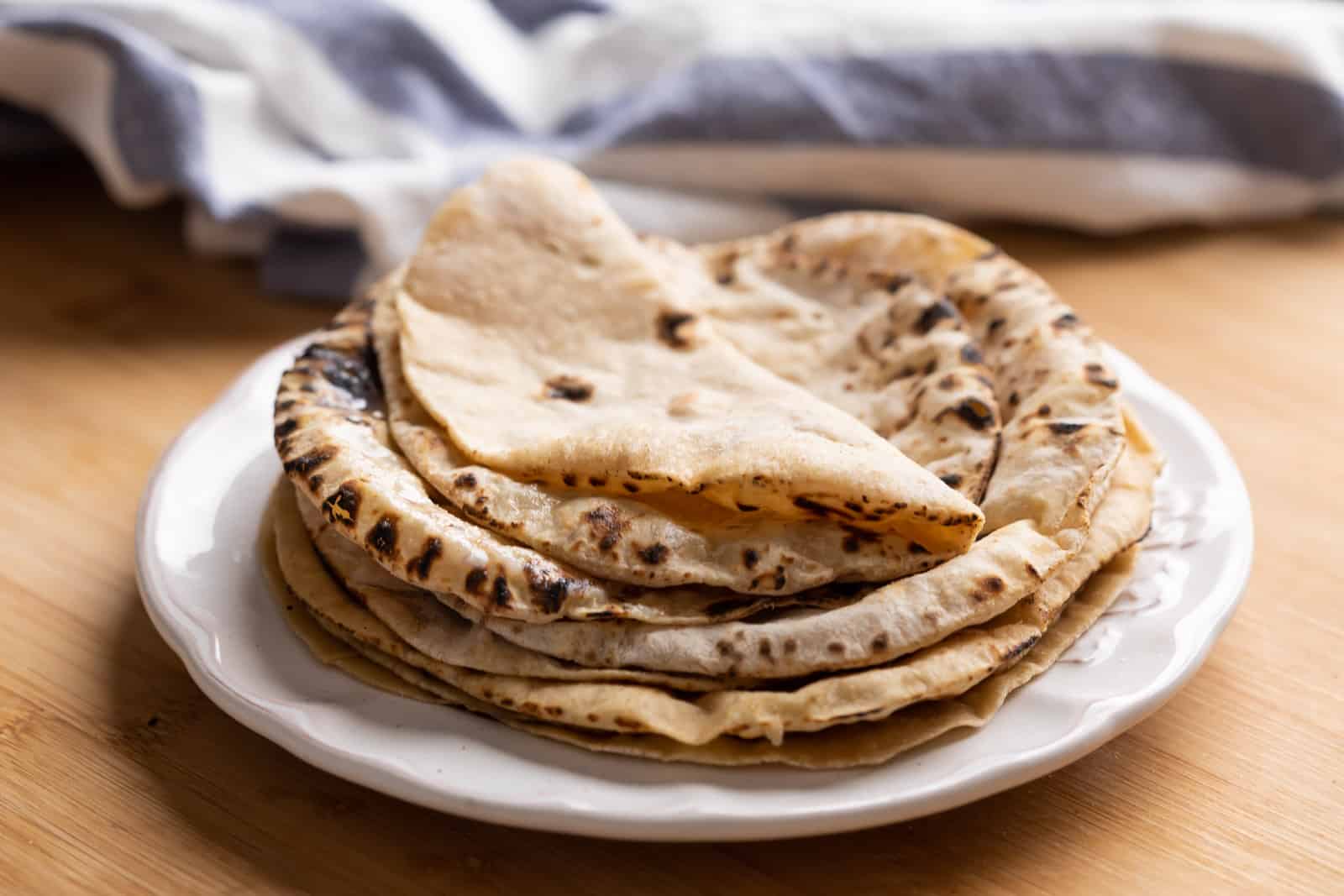 Soft rotis stacked on top of one another