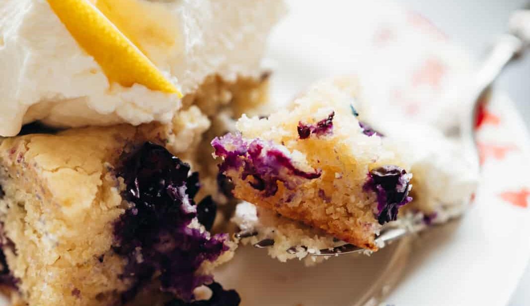 Closeup of a bite of lemon blueberry cake bars
