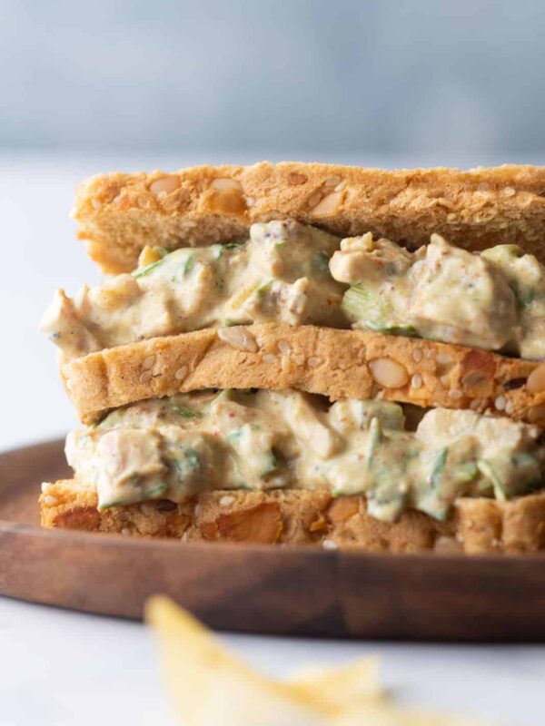 Closeup of curry chicken salad sandwich on a plate