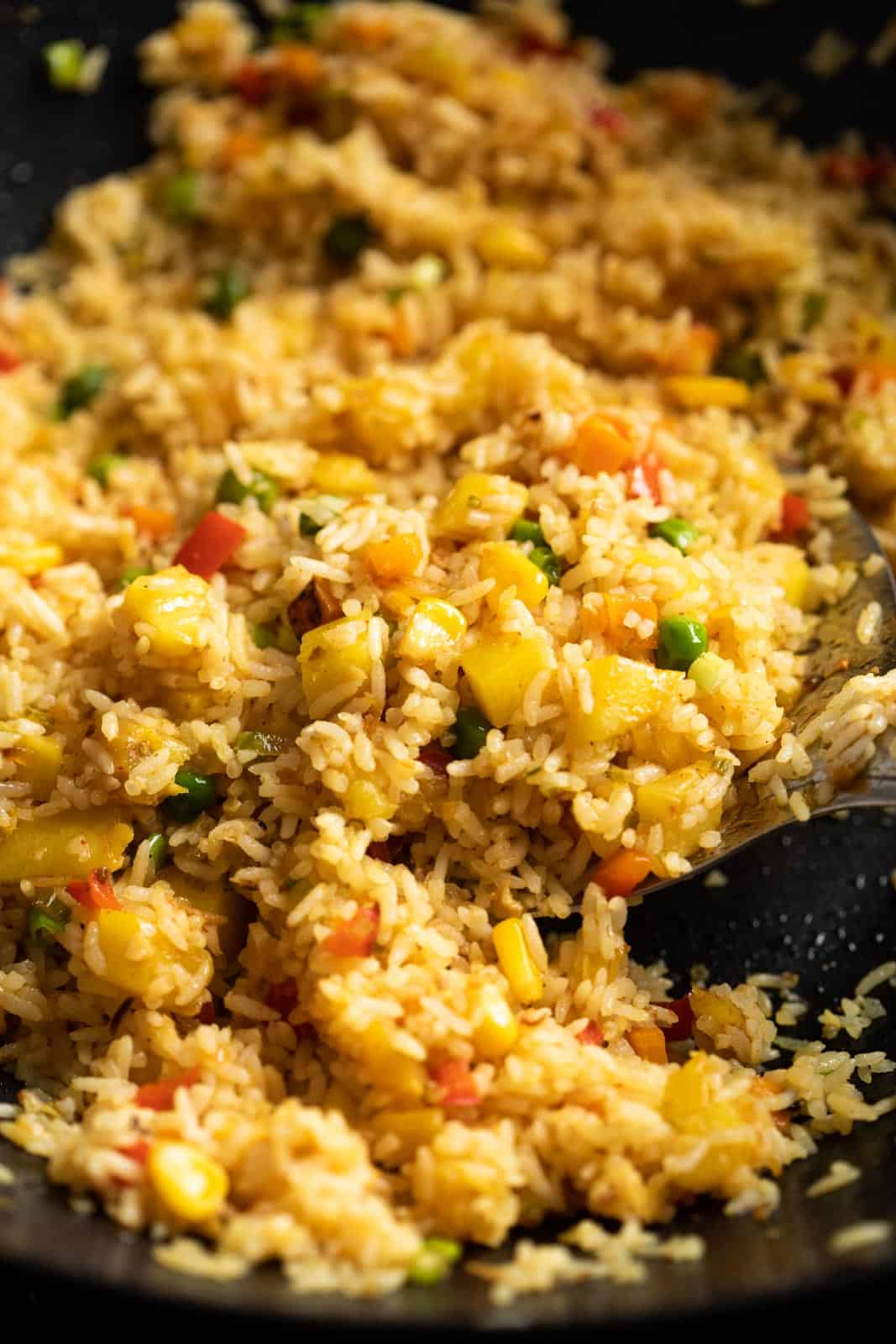 Closeup of pineapple fried rice in a wok