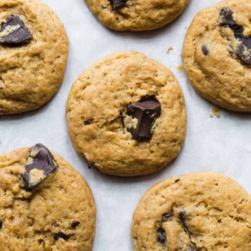 Eggless chocolate chips cookies freshly baked on a cookie sheet