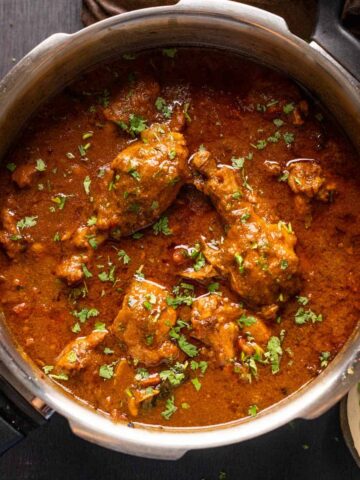 Dhaba style chicken curry served in the pressure cooker it was made in