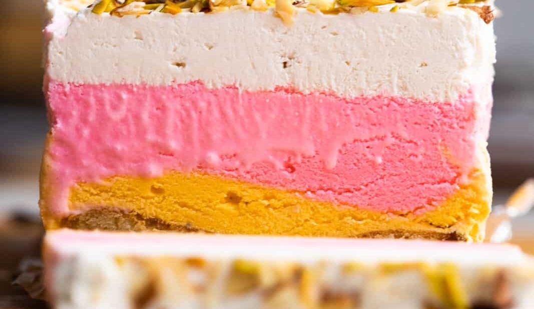 Classic Cassata sliced on a worktop showing all the four layers