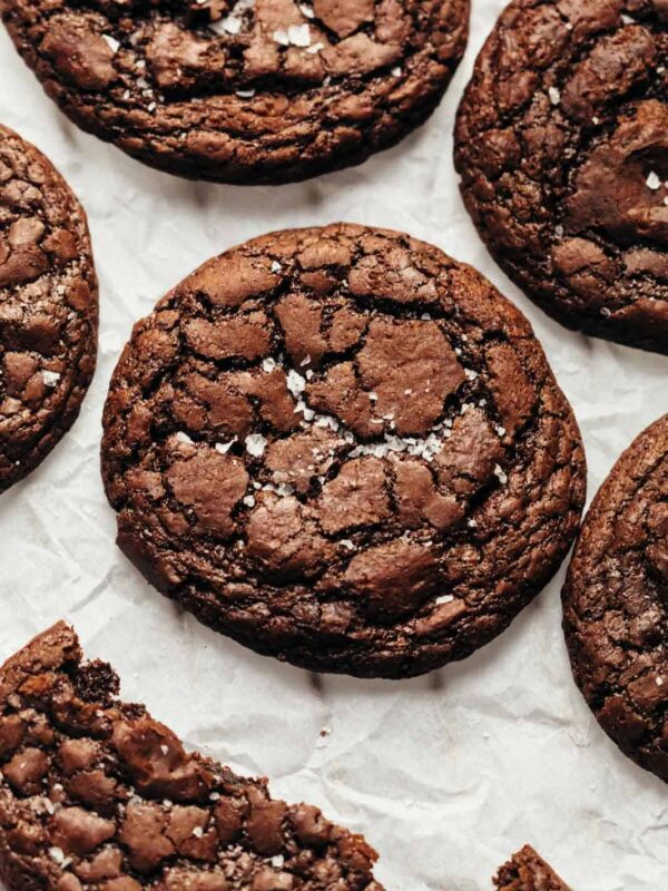 Brownie Cookies sprinkled with sea salt and placed on a tray lined with parchment paper