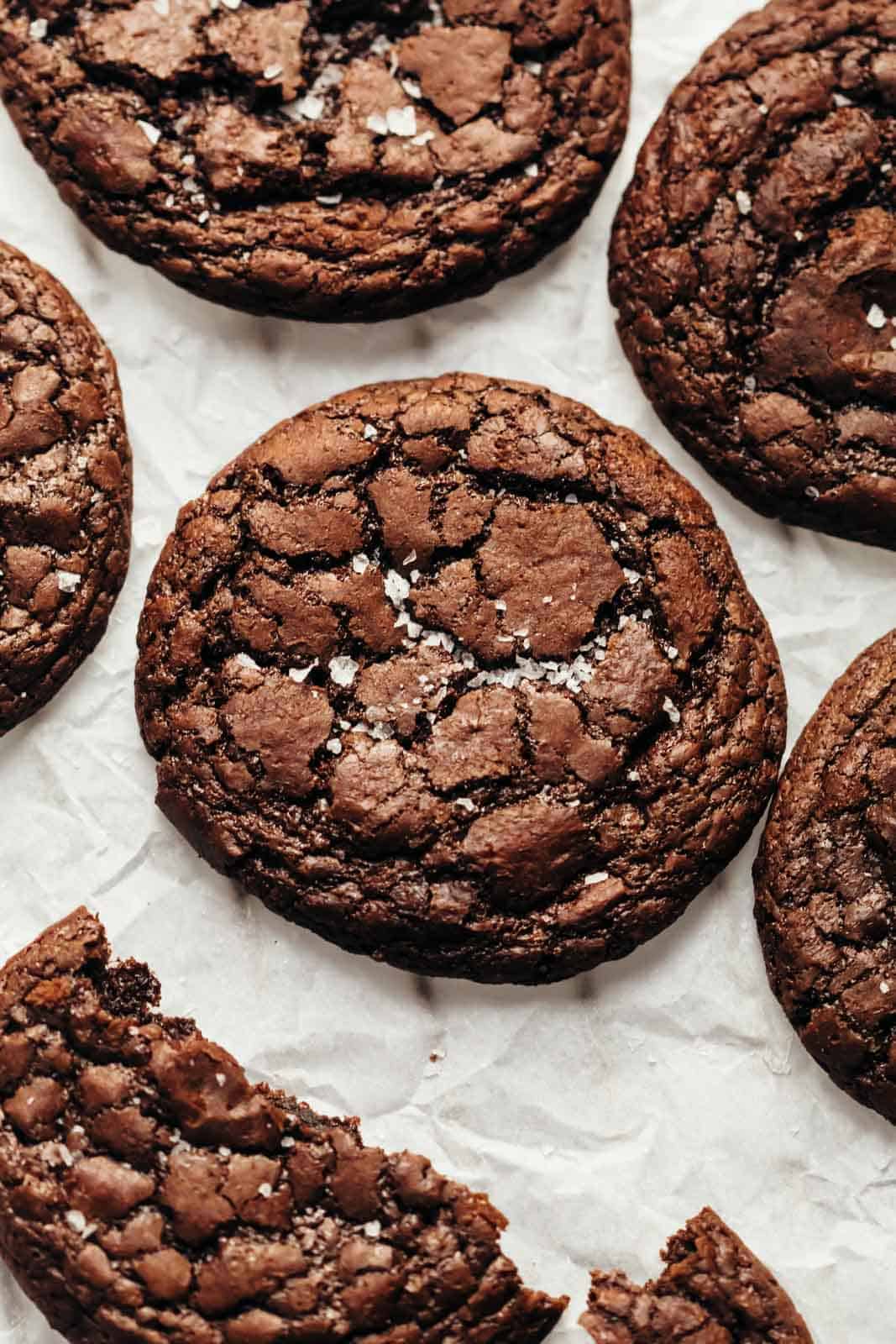Brownie Cookies sprinkled with sea salt and placed on a tray lined with parchment paper