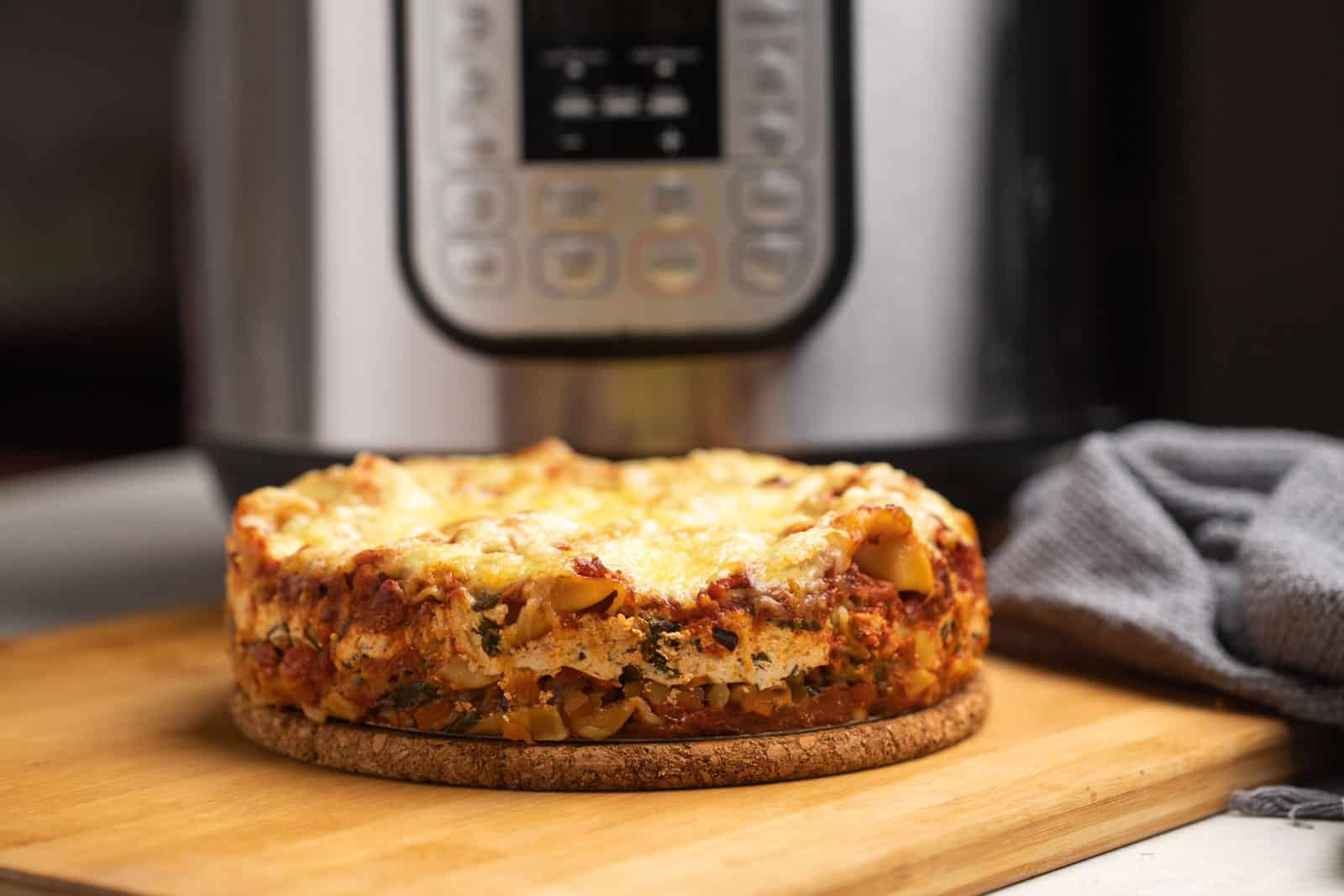 Instant Pot lasagna served with the Instant Pot in the background