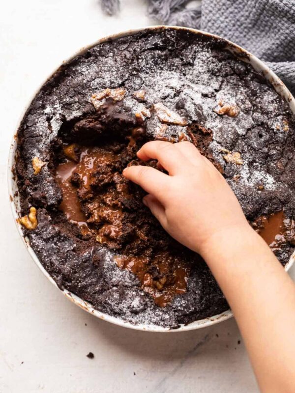 My daughter reaching for the chocolate pudding cake