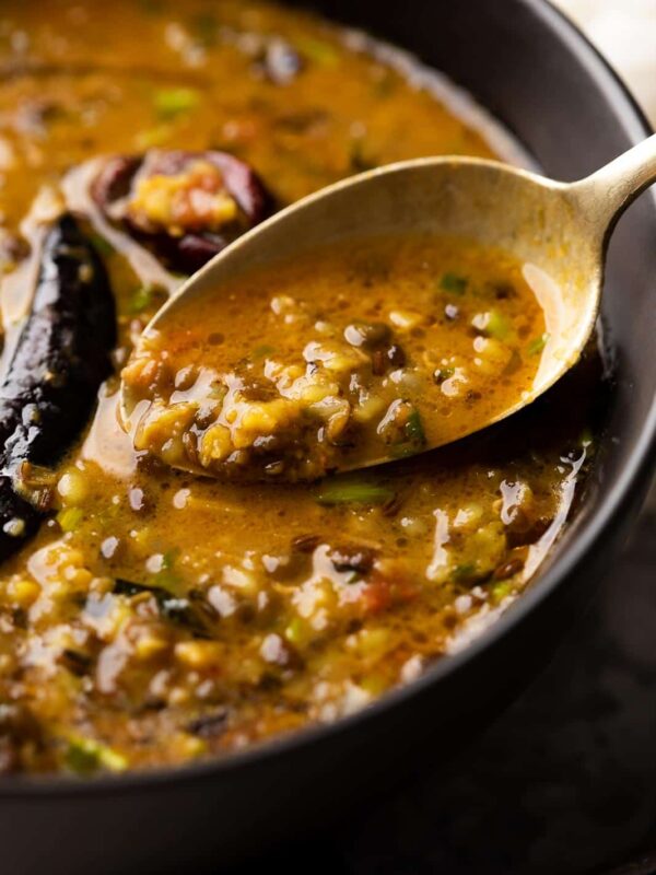 Closeup of a spoonful of Dhaba style moong dal to show the texture and creaminess