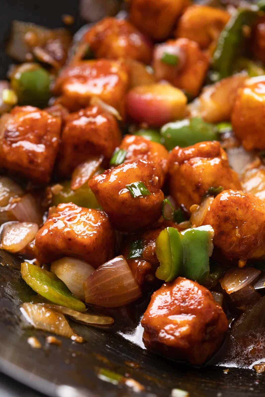 Close up of street style chilli paneer in a wok