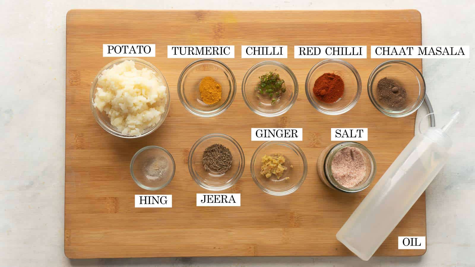 Picture of all the ingredients required for potato filling/aloo masala