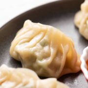Closeup of momos on a grey plate