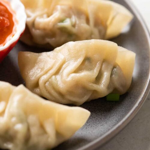 Momos served on a grey plate